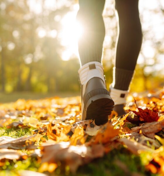 Older adult enjoying time outdoors surrounded by trees